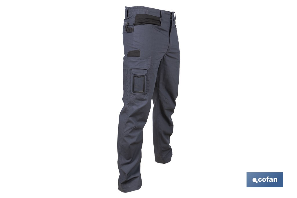 Pantalón de trabajo modelo Loki en gris | Elástico, ligero con múltiples bolsillos | Materiales: 65 % poliéster, 32 % algodón | Disponible en amplio rango de tallas - Cofan
