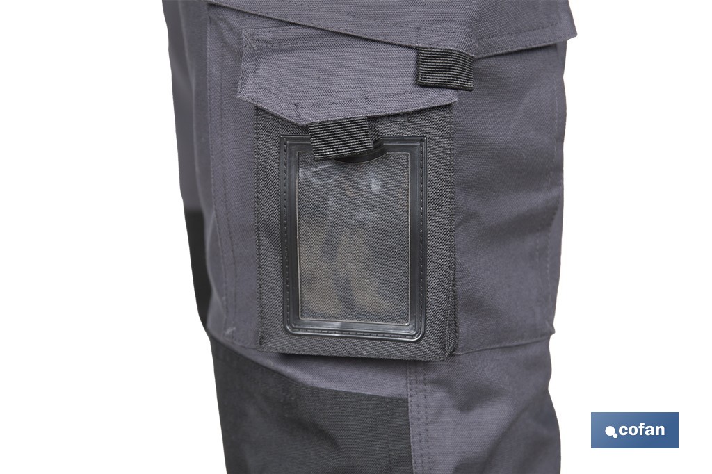Pantalón de trabajo modelo Heimdall en gris oscuro y negro | Elástico, reforzado con múltiples bolsillos | Materiales: 65 % poliéster, 32 % algodón | Disponible en amplio rango de tallas - Cofan