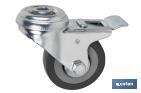 Roulette en caoutchouc gris avec frein en métal pour vis traversante | Diamètres de 50 à 75 mm | Pour des poids de 36 kg jusqu'à 45 kg - Cofan