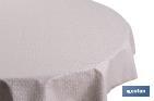 Mantel redondo antimanchas confeccionado en Jacquard con tejido resinado | Diseño de pétalos sobre beige | Materiales: 50% algodón y 50% poliéster | Diferentes medidas - Cofan